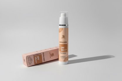 Sunscreen spray bottle with packaging on a light surface