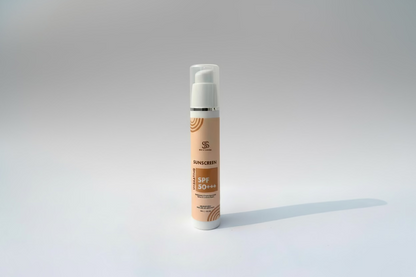 Sunscreen bottle with SPF 50+ on a light background